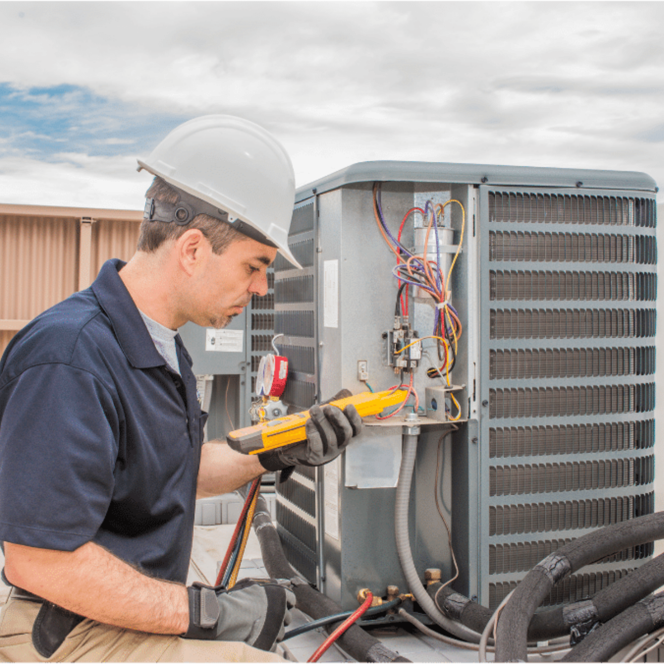 Listowel Heating & Cooling HVAC technician servicing a system