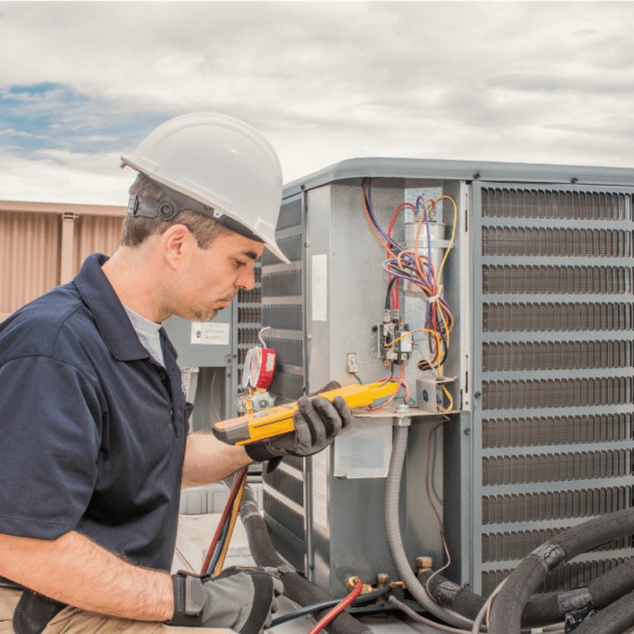 Listowel Heating & Cooling HVAC technician servicing a system